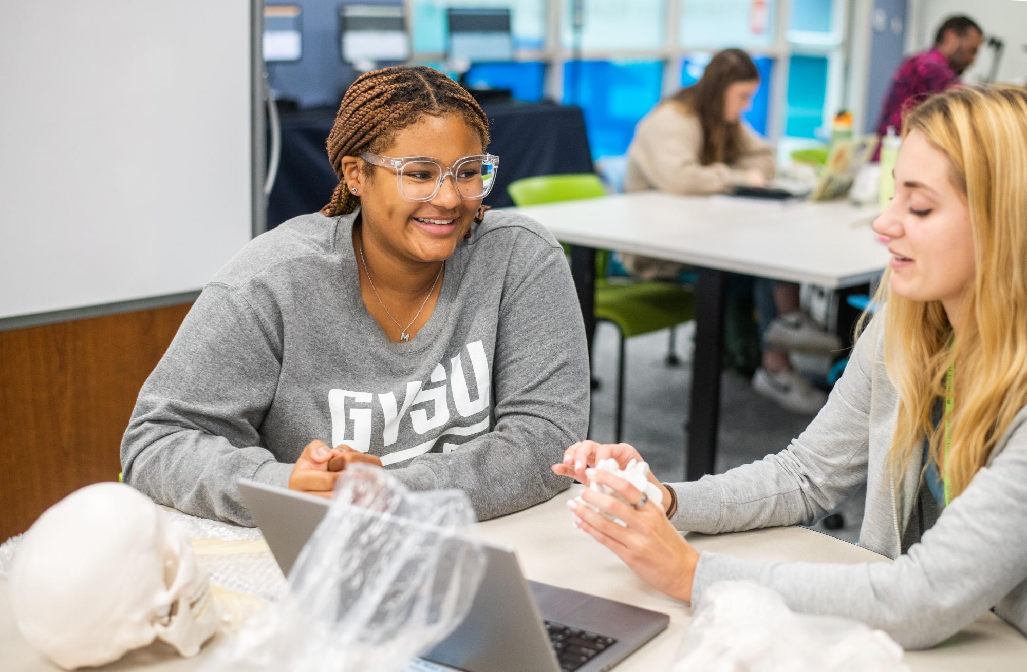 Smiling students studying